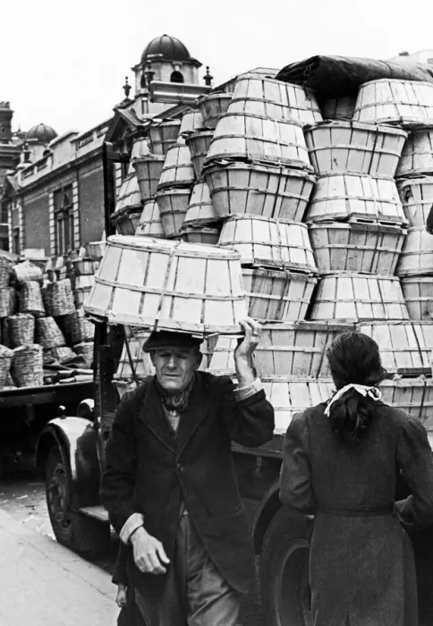 Framed Print : Covent Garden Market, Elderly man carried baskets on his head through the market streets Framed Print : Covent Garden Market, Elderly man carried baskets on his head through the market streets