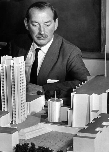 The Coventry City Architect, Mr Arthur Ling, studies a model of his new design for