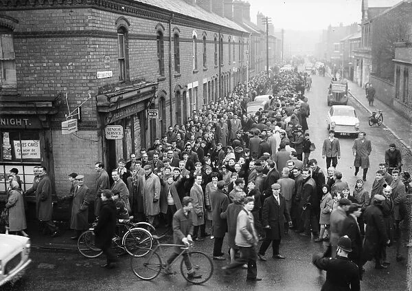 Coventry City fans queue for tickets to the second division title match against Wolves