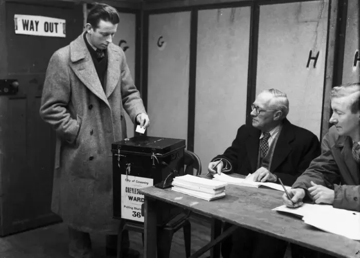 Framed Print : A Coventry voter casts his vote in the 1959 General Election at Cheylesmore polling
