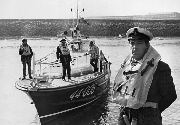 Coxswain Frank Tinsley stands in from of the Barry lifeboat RNLB Arthur