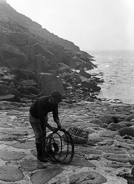 Crabpot making at Penberth, Finishing off a crab pot. Cornwall. 1923