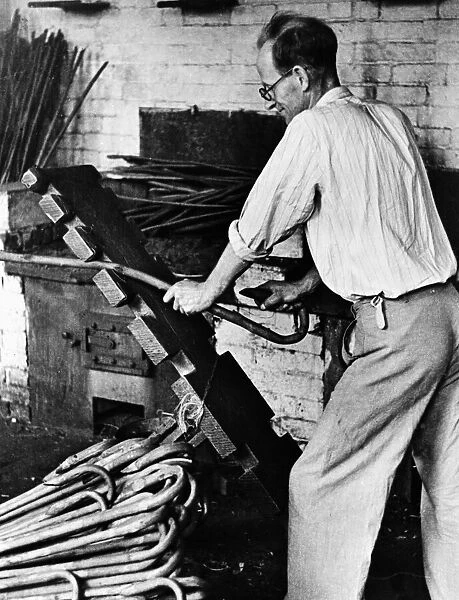 Craftsman making walking sticks circa 1935