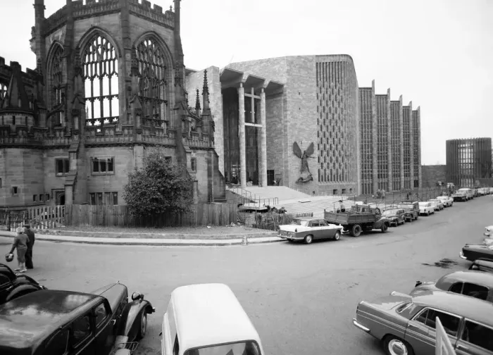 Framed Print : Craftsmen put the finishing touches to the new Coventry Cathedral which stands alongside