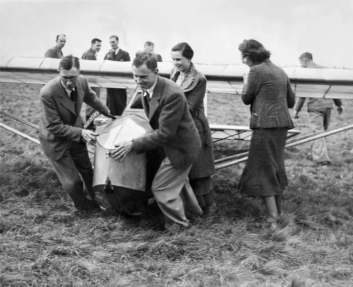Framed Print : Cramlington Gliding Club members hauling into position their new machine Framed Print : Cramlington Gliding Club members hauling into position their new machine