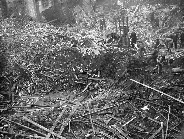 The crater left by an enemy bomb in Christian Street, Liverpool after a heavy air raid by