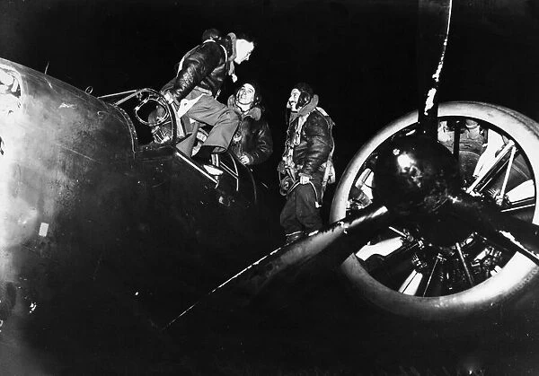 Crew of a Handley Page Hampden Bomber in conversation after the nights mission at RAF
