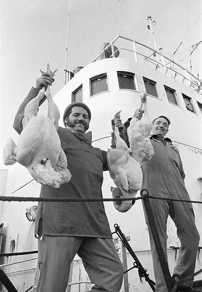 Crew members of the Hull trawler Lord Nelson show off their Christmas turkeys as they