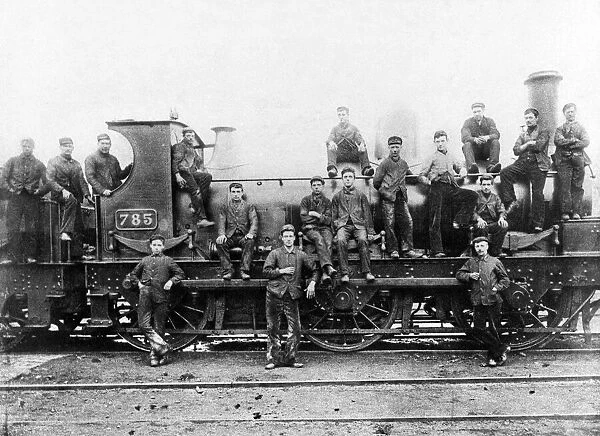 The crew of an steam locomotive pose beside the engine at Stafford Road sheds, circa 1900