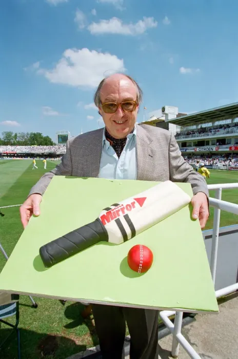 Framed Print : Cricket commentator Henry Blofeld is presented with a Daily Mirror cake in the shape of a Framed Print : Cricket commentator Henry Blofeld is presented with a Daily Mirror cake in the shape of a