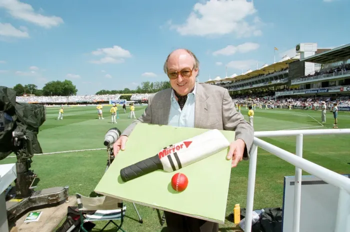 Framed Print : Cricket commentator Henry Blofeld is presented with a Daily Mirror cake in the shape of a Framed Print : Cricket commentator Henry Blofeld is presented with a Daily Mirror cake in the shape of a