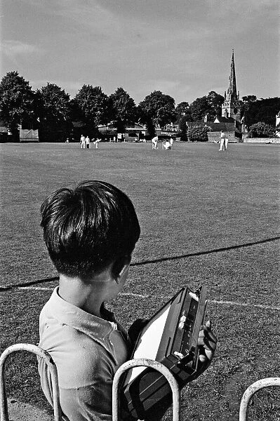 A cricket match takes place in the village of Wombourne in Staffordshire, England