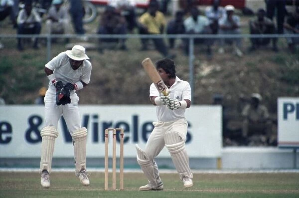 Cricket - Test. England v. Jamaica. February 1990 90-1064A-028. Allan Lamb and Jeff Dujon