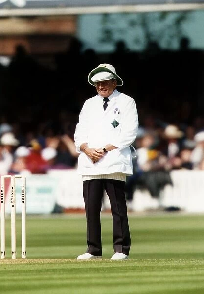 Cricket test umpire Dickie Bird weaing two hats, May 1993