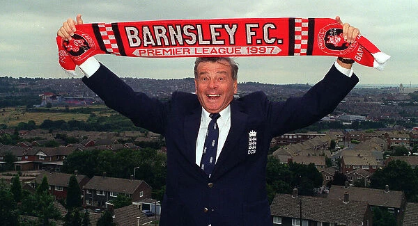 Cricket umpire Dickie Bird celebrates the arrival of his hometown club Barnsley in