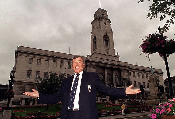 Cricket umpire Dickie Bird poses in front of Barnsley Town Hall as he celebrates his