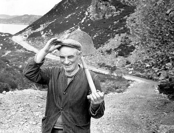 Crofter, Callum MacLeod, 63, shoulders his shovel after another day