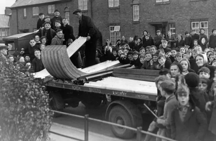 Framed Print : A crowd of excited yougsters watch the delivery of the first consignment of A. R. P