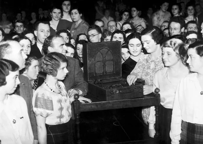 Framed Print : A crowd of people huddle around a wireless to listen to the Abdication Speech of King Framed Print : A crowd of people huddle around a wireless to listen to the Abdication Speech of King