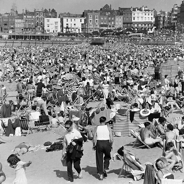 Crowded beach at Margate with holiday makers enjoying the sun. 4th August 1964