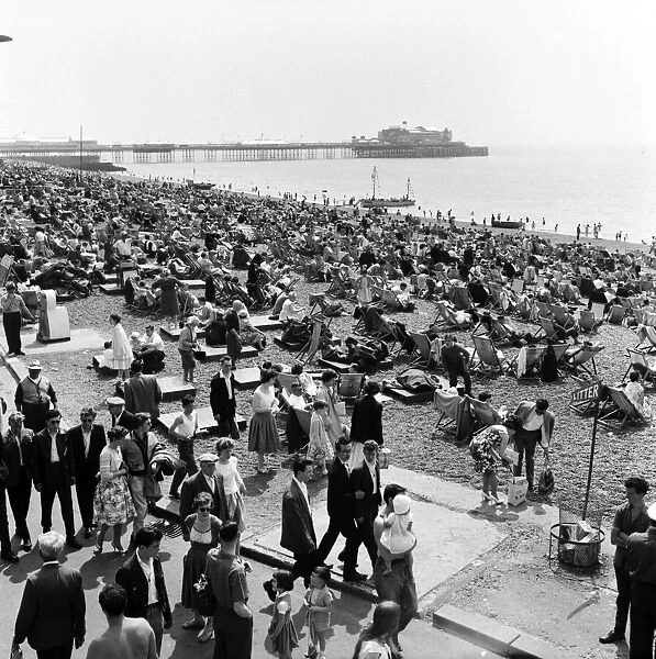 Crowded scenes on Brighton Beach as holidaymakers enjoy the hot summer weather