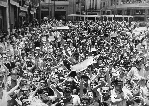 A crowded street in the city of Beirut as local residents turn out to cheer the British