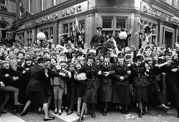 Crowds of Beatles fans outside the ABC theatre as the Beatles arrive for the Northern