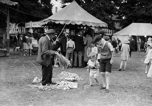 Crowds enjoying the Tolworth Fun Fair in 1934
