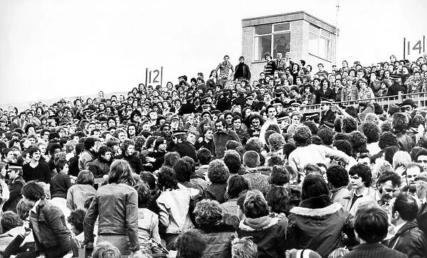 Crowds of football fans being controlled by police in 1978