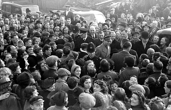 Crowds gather to greet King George VI on his visit to Birmingham to survey the bomb