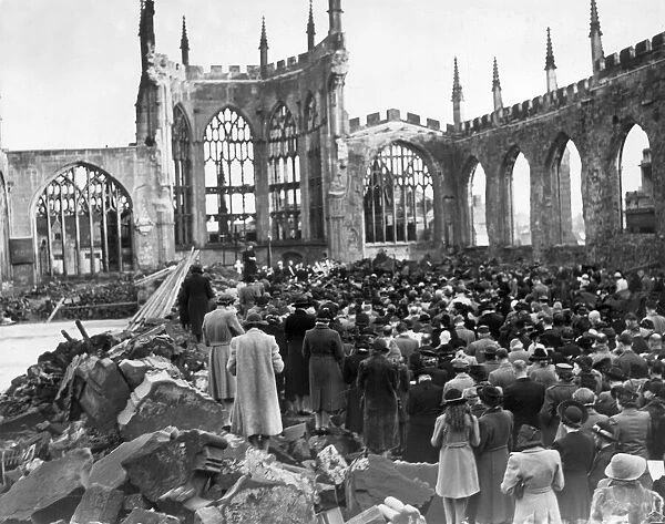 Crowds gather for a remembrance service inside the ruins of Coventry Cathedral after it