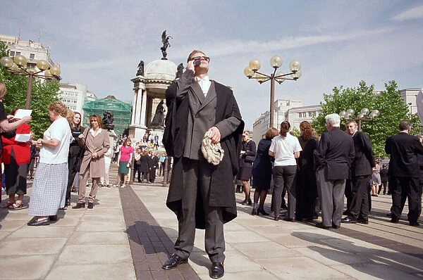 Crowds in Liverpool city centre watching the solar eclipse. 11th August 1999