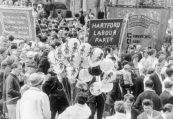 Crowds mingle with the balloons and banners at the Northumberland Miners Gala at