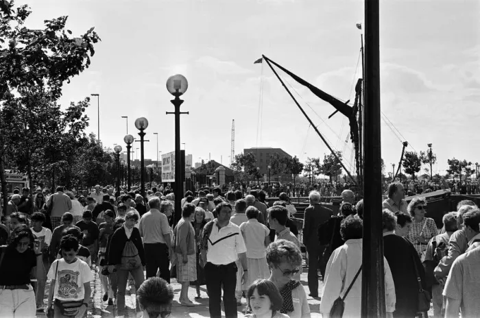 Framed Print : Crowds of people line the dock road set for a day out at Liverpool Albert Dock to see Framed Print : Crowds of people line the dock road set for a day out at Liverpool Albert Dock to see