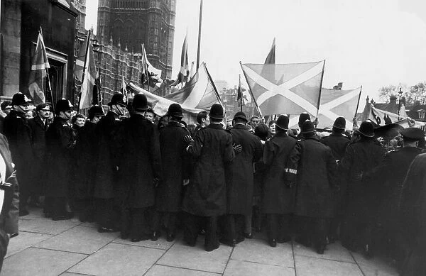 Crowds of supporters of Scottish Nationalist MP Winnie Ewing guarded by a long line of