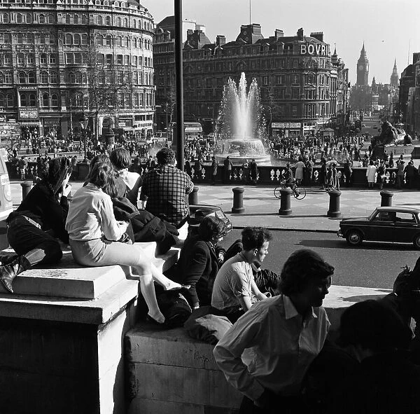 The crowds in Trafalgar Square, London, enjoying a heatwave in March. 29th March 1965