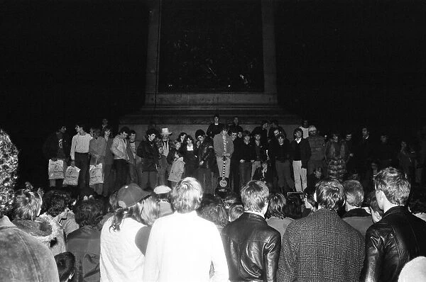 Crowds in Trafalgar Square for a ten minute prayer for John Lennon. 14th December 1980