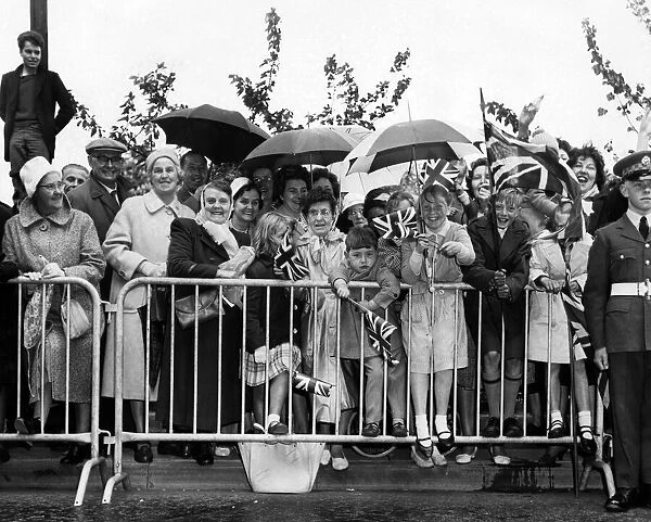 Crowds waiting to greet Queen Elizabeth II during her visit to Solihull in the West