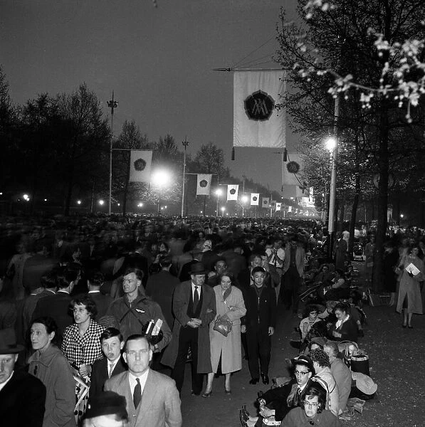Crowds waiting for the wedding the following day of Princess Margaret