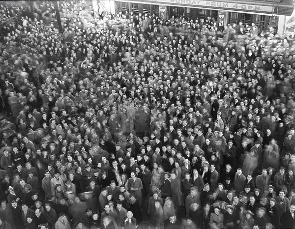 Crowds welcome in new year in Piccadilly Circus London 1st Jan 1950 022056  /  7
