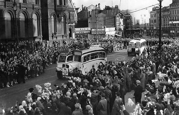 Crwods line the streets of Liverpool city centre as they welcome home the Liverpool team