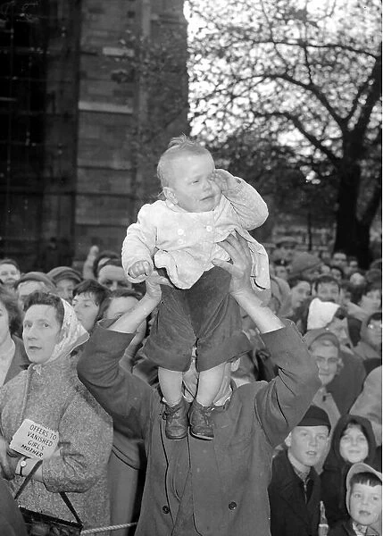 Crying child in waiting to see the Queen in Carlisle in 1958