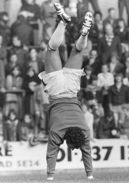 Crystal Palace goalkeeper John Burridge indulges in some amusing acrobatics before a