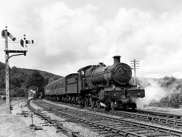 The Cumbrian Coast Express train passes Talerdigg bank on a summers day, Circa 1965