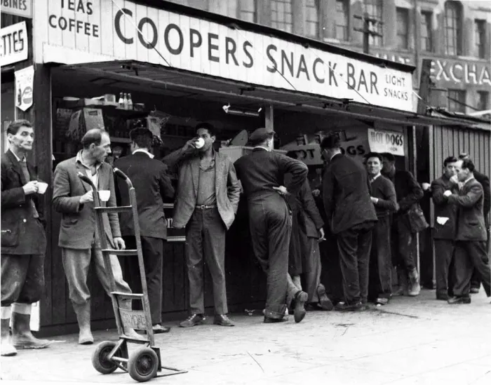 Framed Print : A cup of tea makes a welcome break for these men, many of whom have been working in