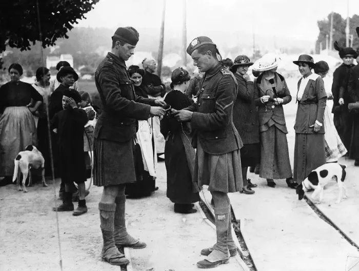 Framed Print : Curious French civilians watch two kilted Scottish soldiers. October 1914 Framed Print : Curious French civilians watch two kilted Scottish soldiers. October 1914