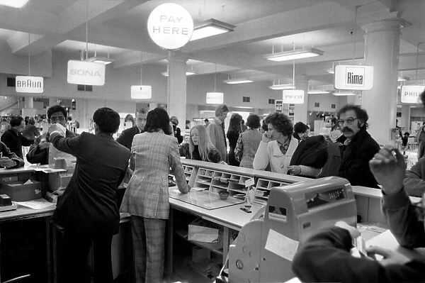 Customers at the Cash Desk in the Electrical section of Selfridges during a sale