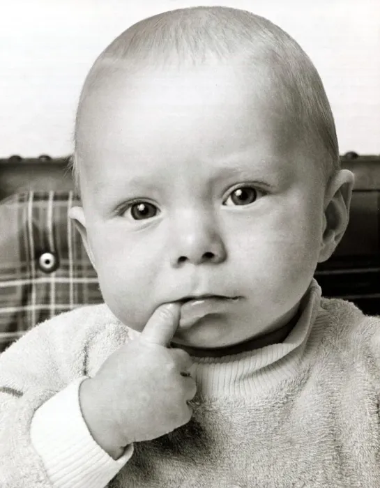 Framed Print : A cute baby looking bemused thinking with one finger in his mouth October 1969 Framed Print : A cute baby looking bemused thinking with one finger in his mouth October 1969