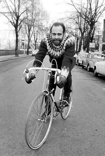 Cycling journalist and writer Mr. Richard Ballantine riding a bicycle February