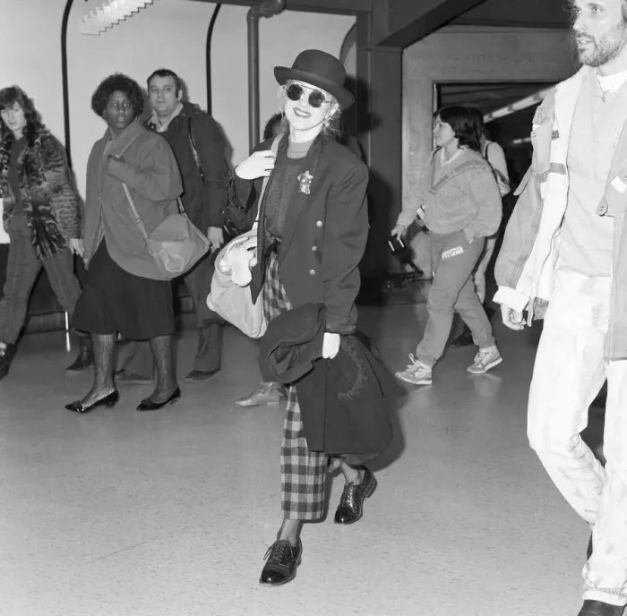 Framed Print : Cyndi Lauper american singer songwriter pictured with manager David Wolff arriving